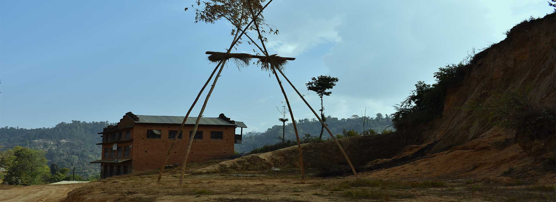 red mud house standing beside a bamboo swing in Nepali village