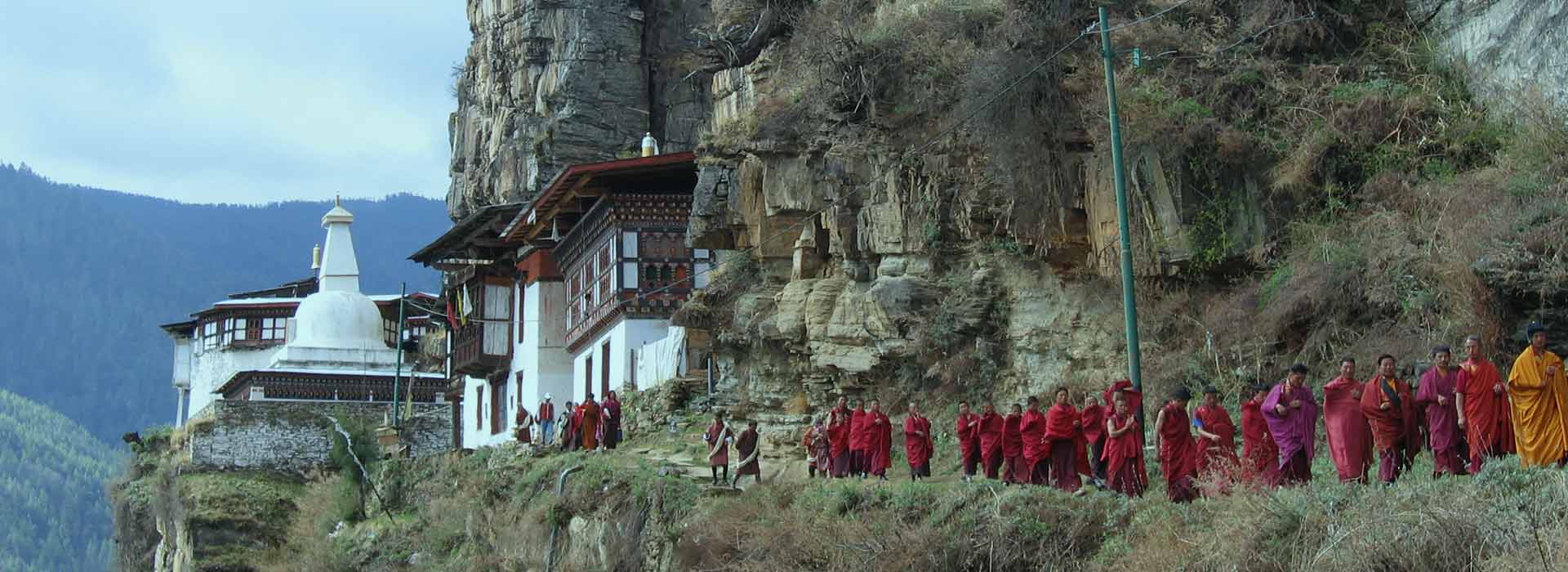 bhutanese monks walking in a file